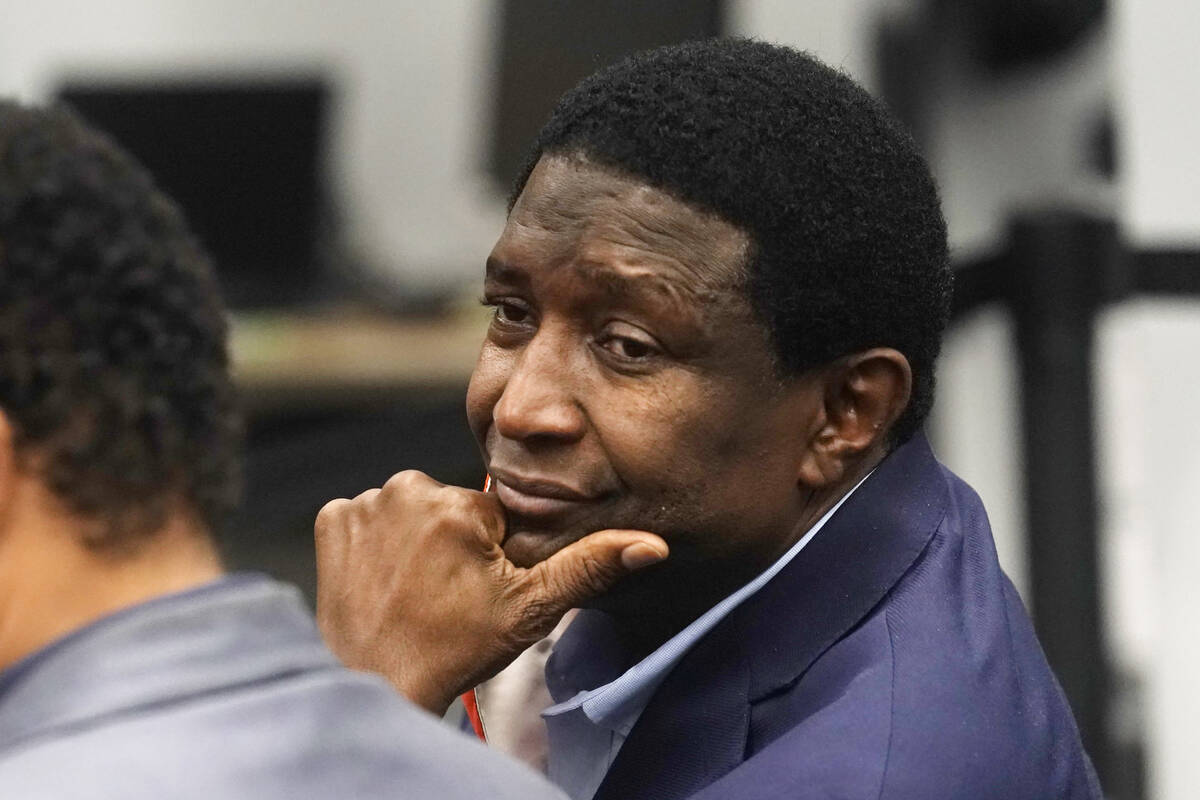 FILE - Dale Holness, waits for results of a machine recount at the Voting Equipment Center in ...