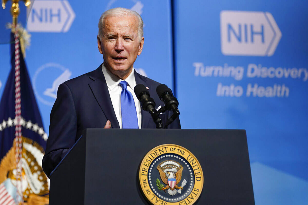 President Joe Biden speaks about the COVID-19 variant named omicron during a visit to the Natio ...