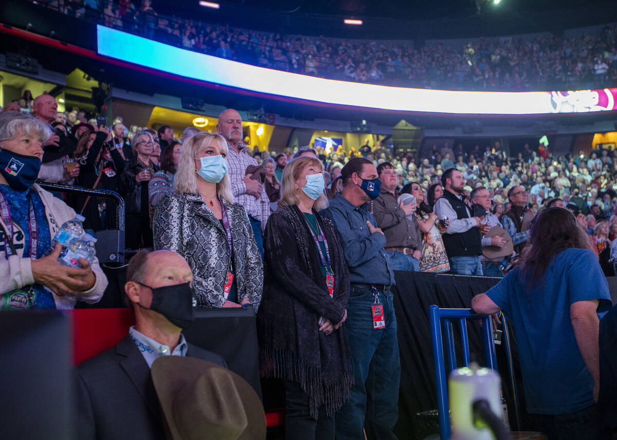 Fans stand for the National anthem during the Day 2 of the Wrangler National Finals Rodeo at th ...