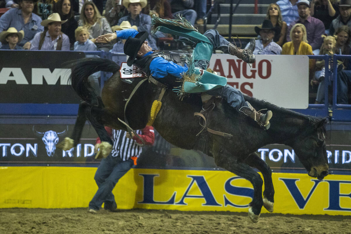 Jess pope of Waverly KS, rides Fired Up in Bareback Riding for first place during the Day 2 of ...