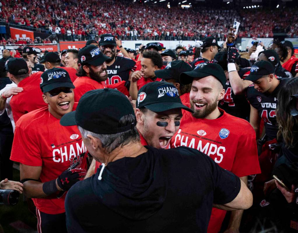 Utah Utes head coach Kyle Whittingham celebrates with his players after beating Oregon Ducks 3 ...