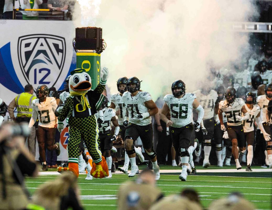 Oregon Ducks players take the field to face Utah Utes during the first half of the Pac-12 champ ...