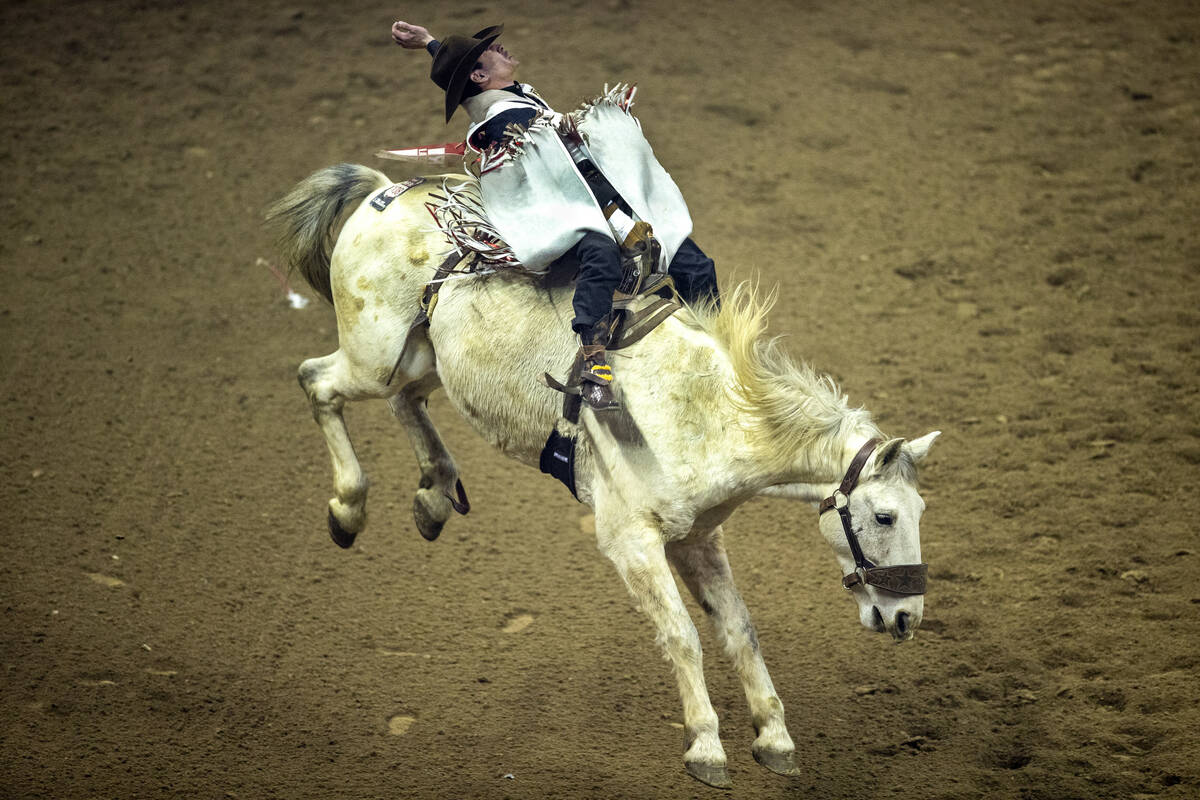 Cole Franks of Clarendon, Texas, rides Deep Springs for first place in Bareback Riding during t ...