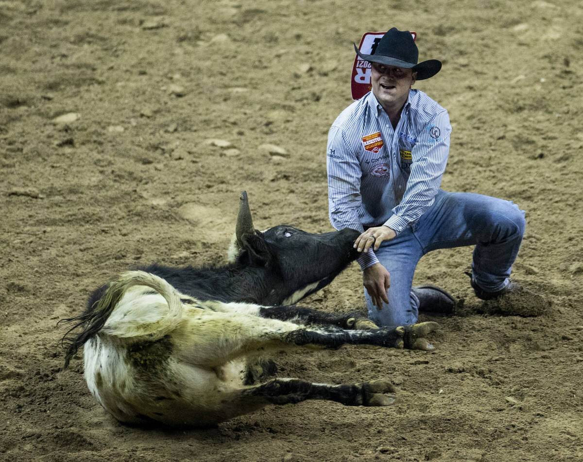 Tristan Martin of Sulphur, Louisiana, is pleased after downing his animal in Steer Wrestling fo ...