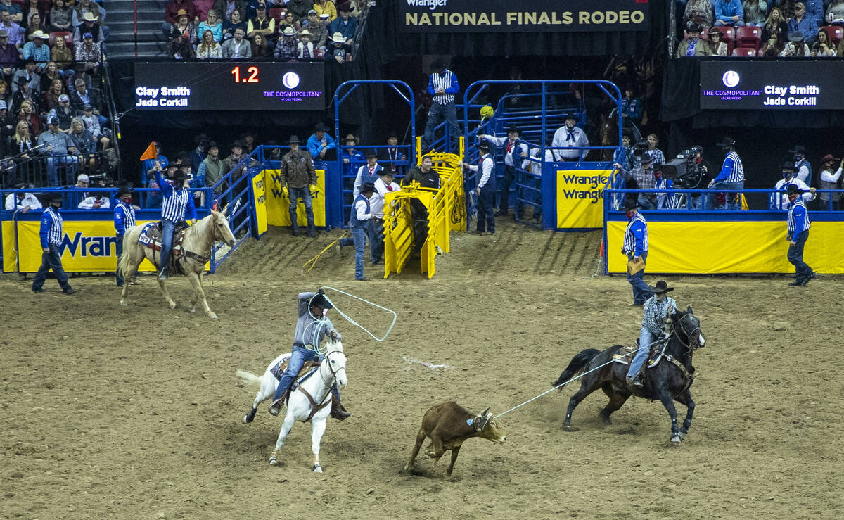 Clay Smith of Broken Bow, Oklahoma, and Jade Corkill of Fallon, Nevada, close in on their anima ...