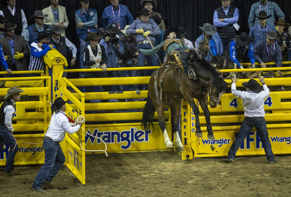 Tegan Smith of Winterset, Iowa, rides Yesterday's Delivery to first place in Saddle Bronc Ridin ...