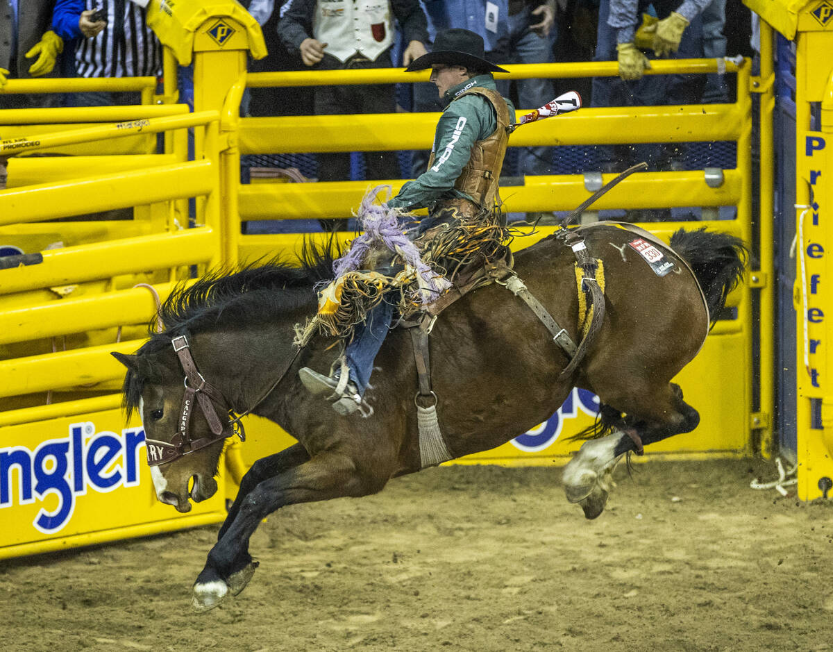 Tegan Smith of Winterset, Iowa, rides Yesterday's Delivery to first place in Saddle Bronc Ridin ...