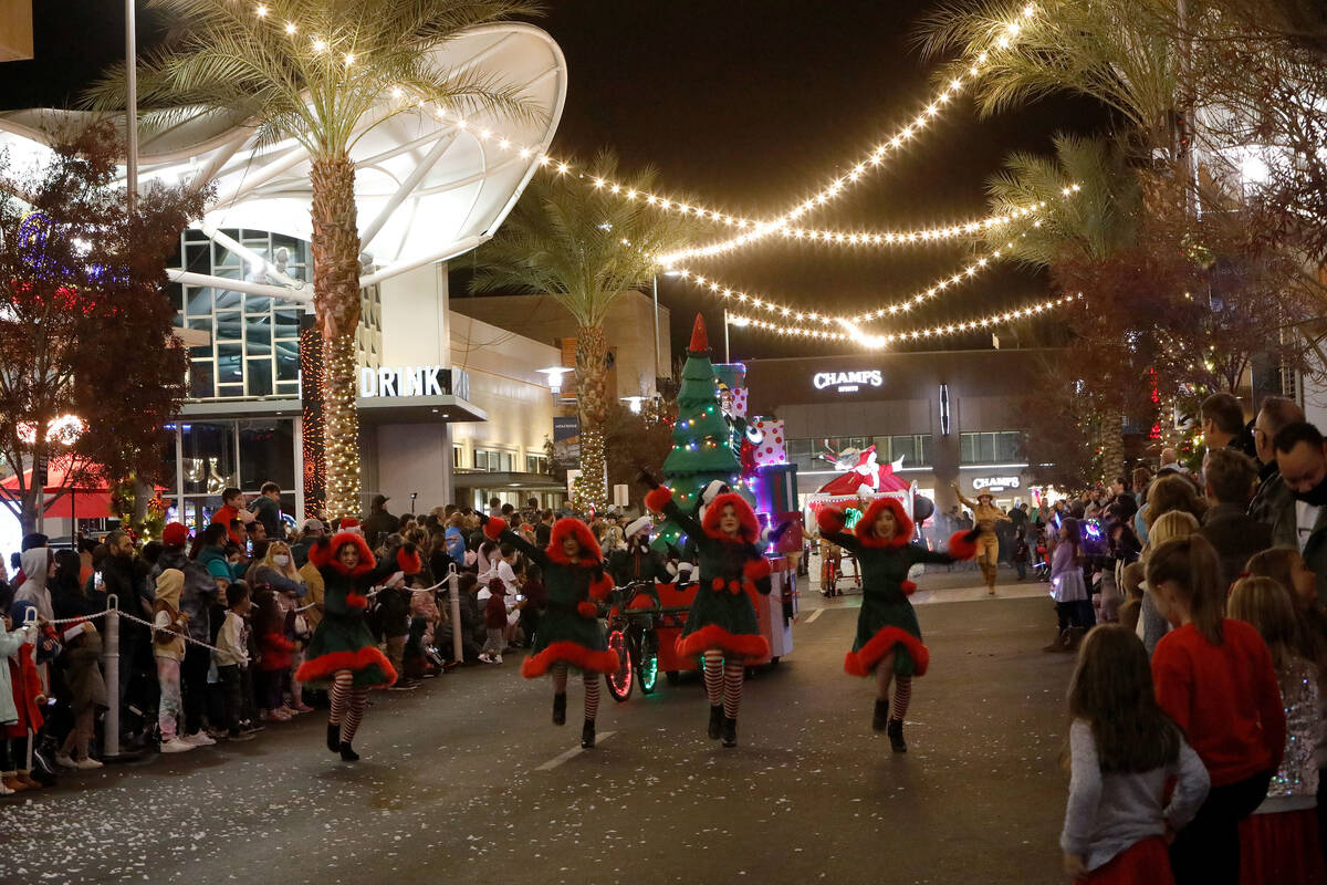 Dancers perform during a holiday parade at Downtown Summerlin, Friday, Dec. 3, 2021, in Las Veg ...