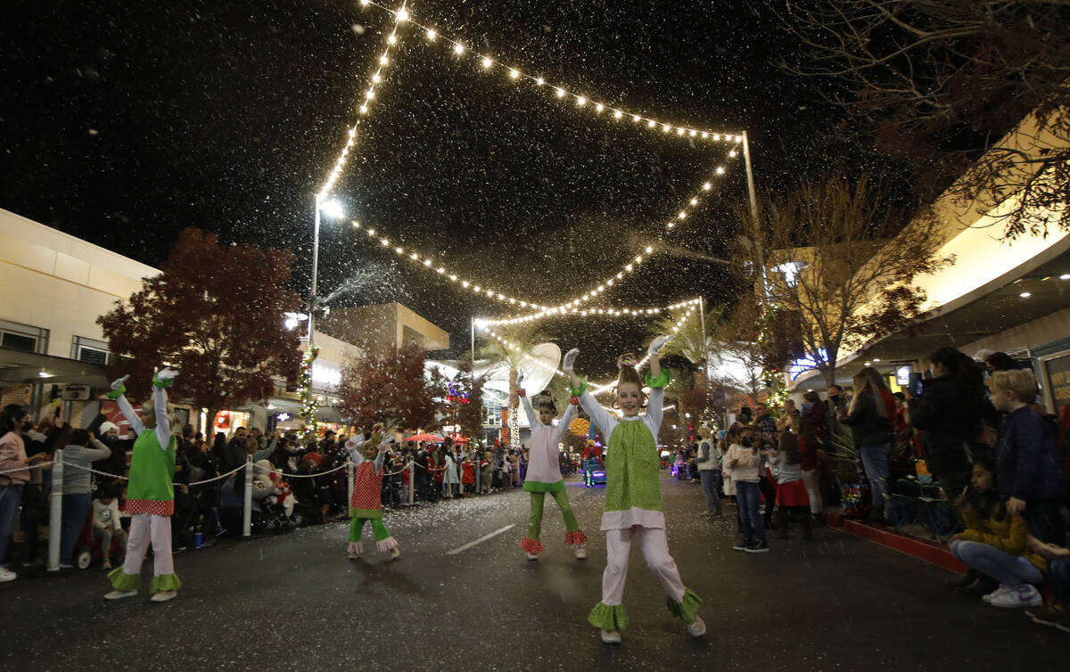 Dancers perform during a holiday parade at Downtown Summerlin, Friday, Dec. 3, 2021, in Las Veg ...