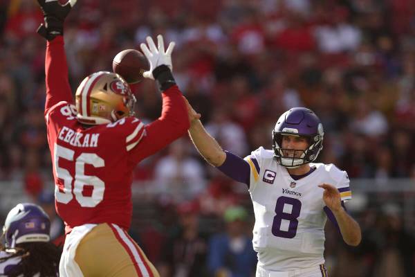 Minnesota Vikings quarterback Kirk Cousins (8) throws a pass against San Francisco 49ers defens ...