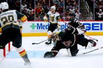 Vegas Golden Knights center Chandler Stephenson (20) scores a goal against Arizona Coyotes goal ...