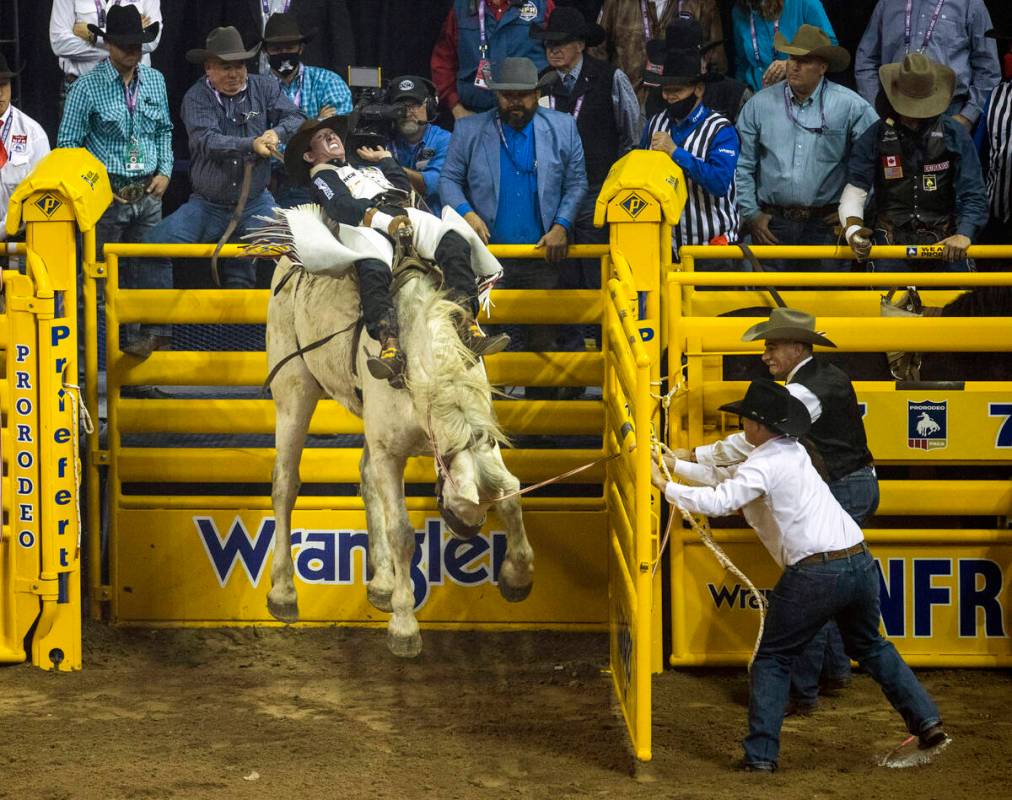 Cole Franks of Clarendon, TX., rides Deep Springs for first place in Bareback Riding during the ...