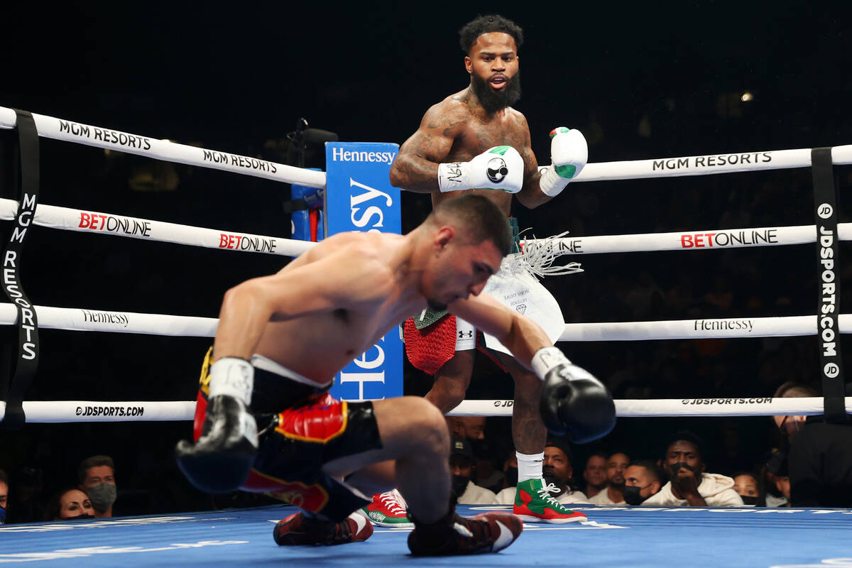 Montana Love, right, knocks down Carlos Diaz in second round of a super lightweight bout at the ...