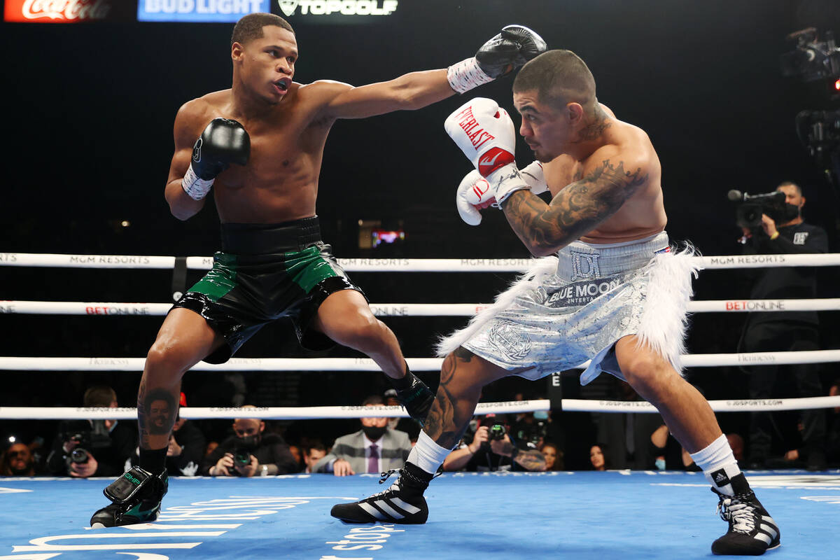 Devin Haney, left, battles Joseph Diaz Jr. in the first round of a WBC lightweight title fight ...
