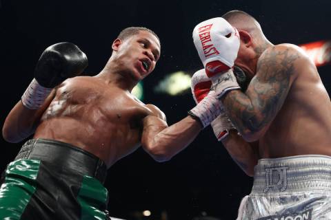 Devin Haney, left, connects a punch against Joseph Diaz Jr. in the 11th round of a WBC lightwei ...