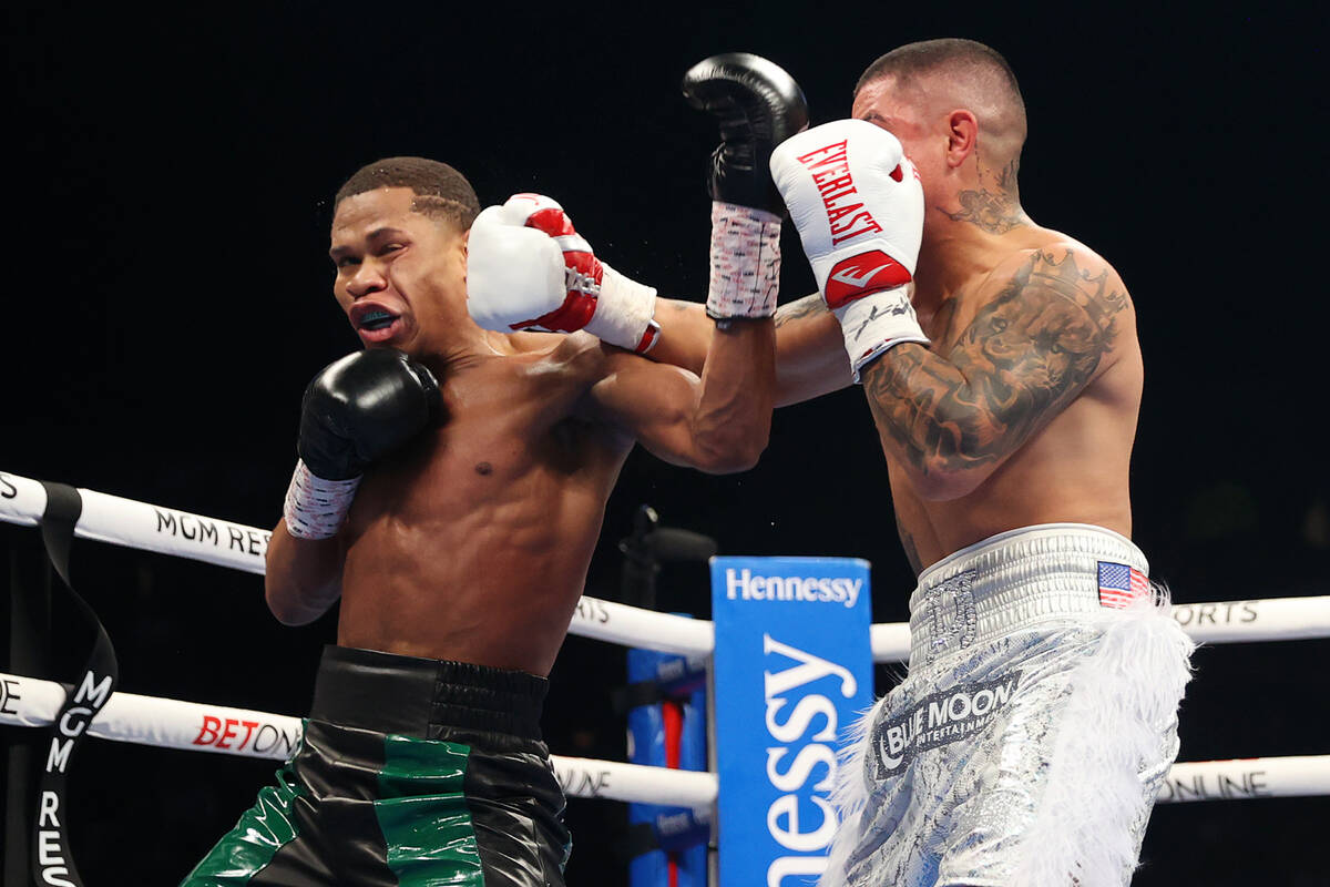 Joseph Diaz Jr., right, connects a punch against Devin Haney in the second round of a WBC light ...