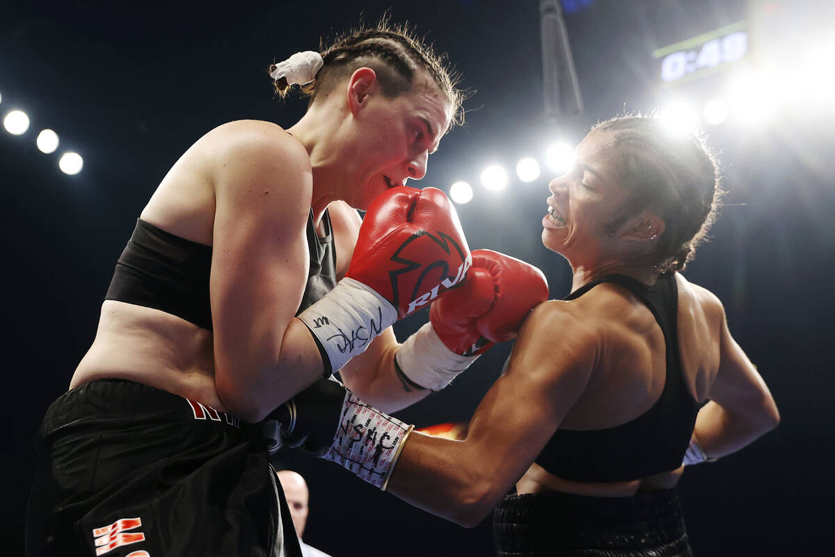 Jessica McCaskill, right, connects with a punch against Kandi Wyatt during the second round of ...