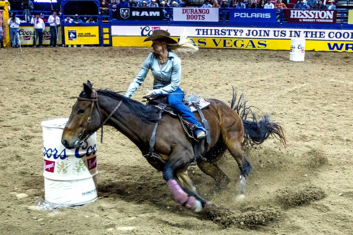 Wenda Johnson of Pawhuska, OK., turns the corner in Barrel Racing during the Day 2 of the Wrang ...