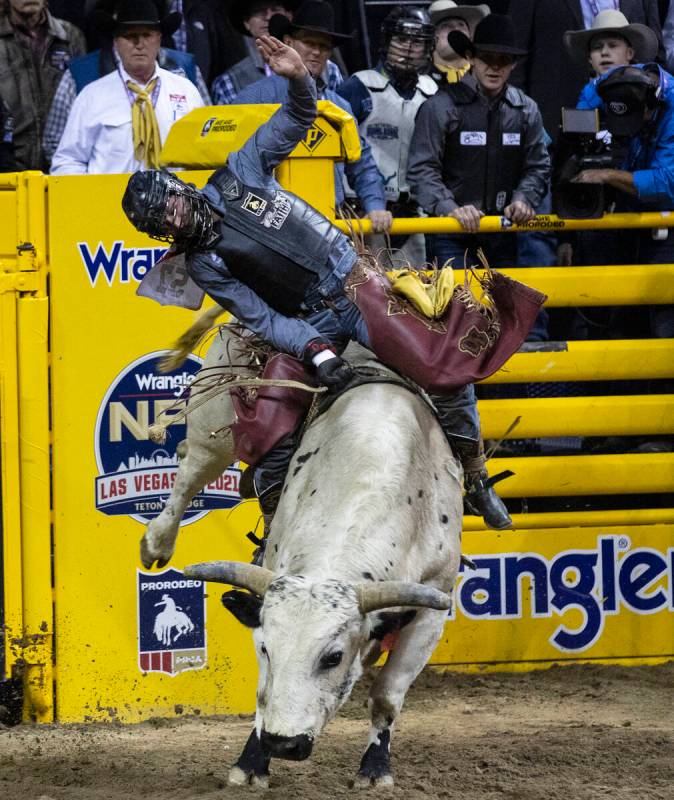 Dustin Boquet of Bourg, La., rides Hous Bad News in Bull Riding during the fourth round of the ...