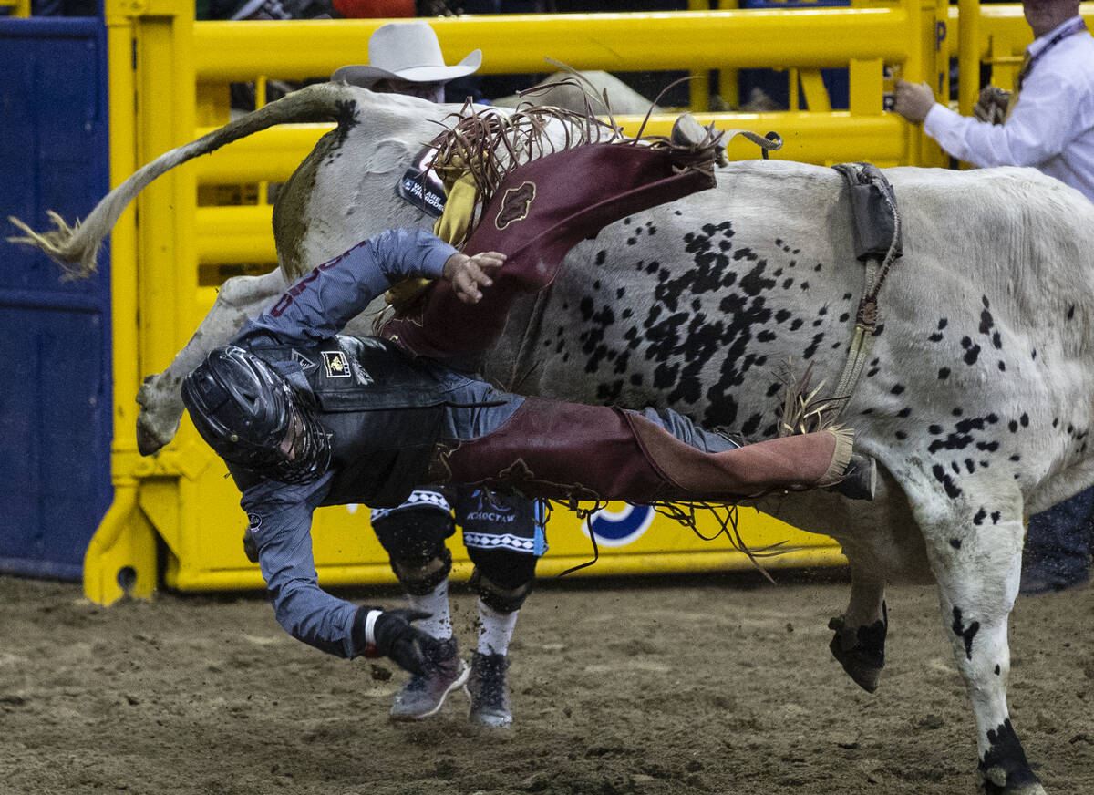 Dustin Boquet of Bourg, La., thrown from rides Hous Bad News in Bull Riding during the fourth r ...