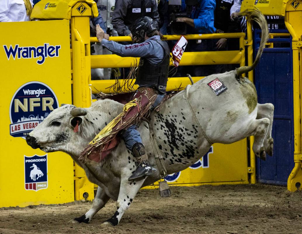 Dustin Boquet of Bourg, La., rides Hous Bad News in Bull Riding during the fourth round of the ...