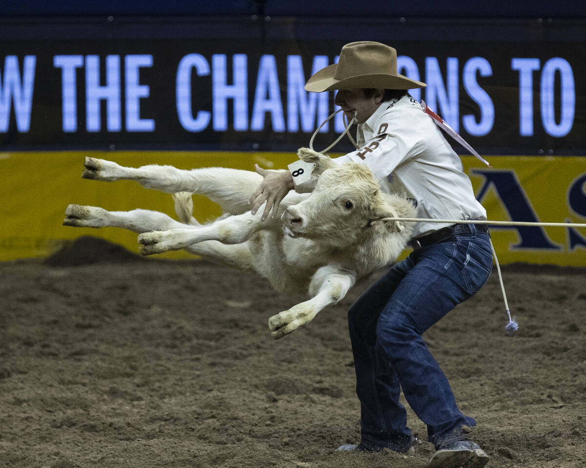 Ty Harris of San Angelo, Texas, in Tie-Down Roping during the fourth round of the Wrangler Nati ...