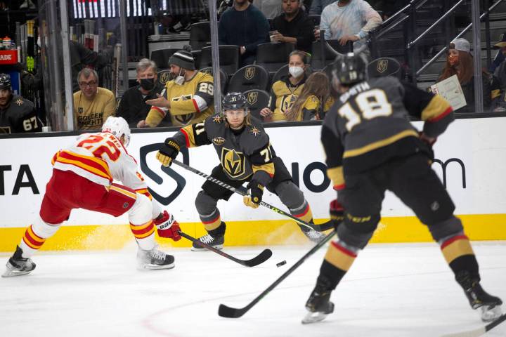 Vegas Golden Knights center William Karlsson, center, passes to Vegas Golden Knights right wing ...