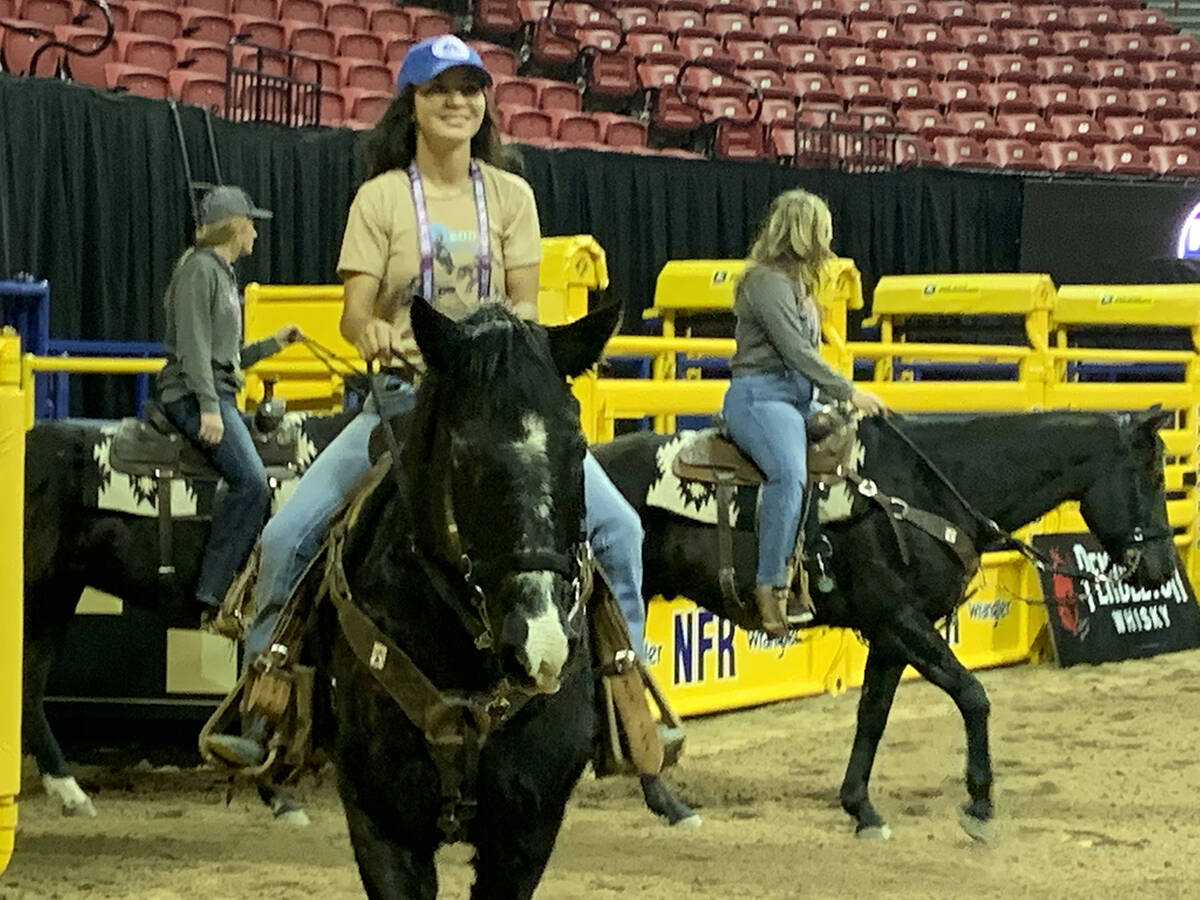 Sierra Wertz of McClave, Colo., left, preps her horse during practice on Friday morning ahead o ...