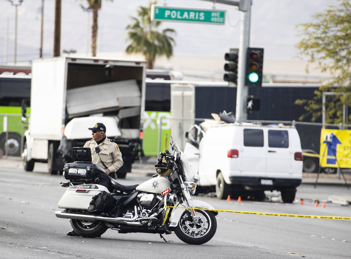 Las Vegas Metropolitan police investigate a fatal crash involving a box truck and a van at the ...