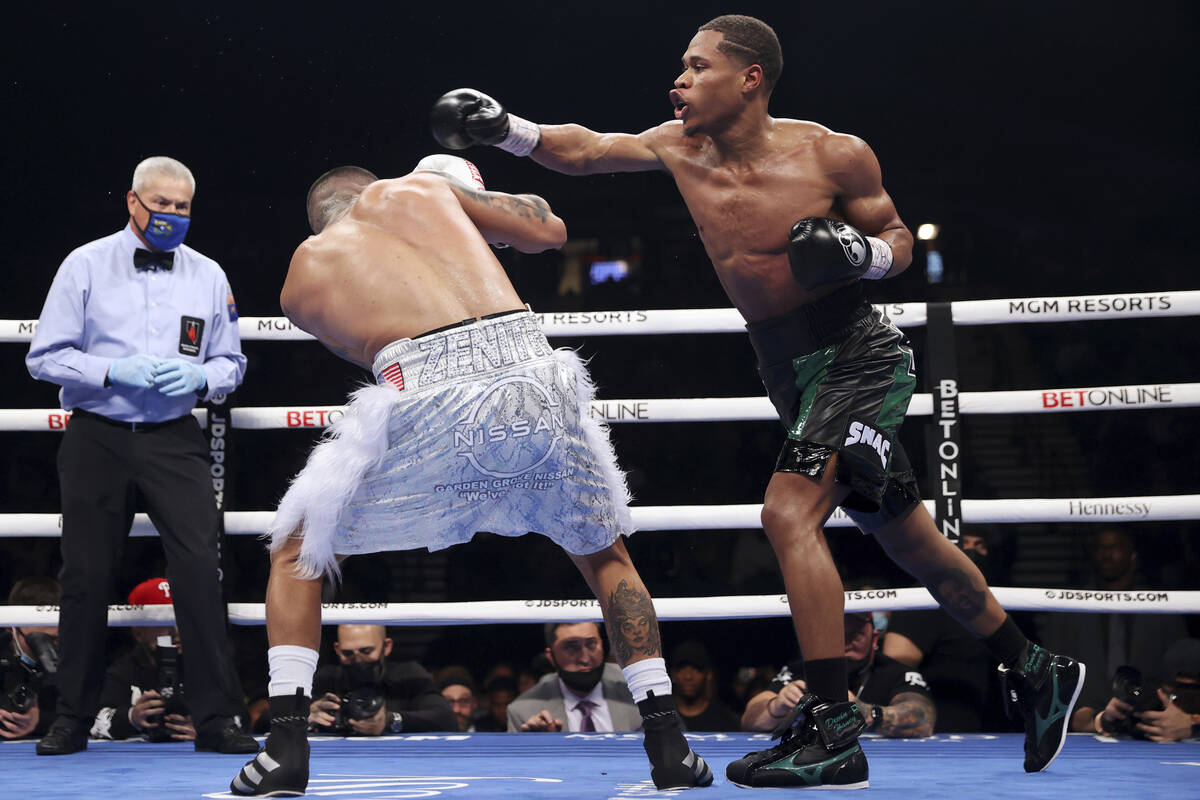 Devin Haney, right, throws a punch atJoseph Diaz Jr. during the third round of a WBC lightweigh ...
