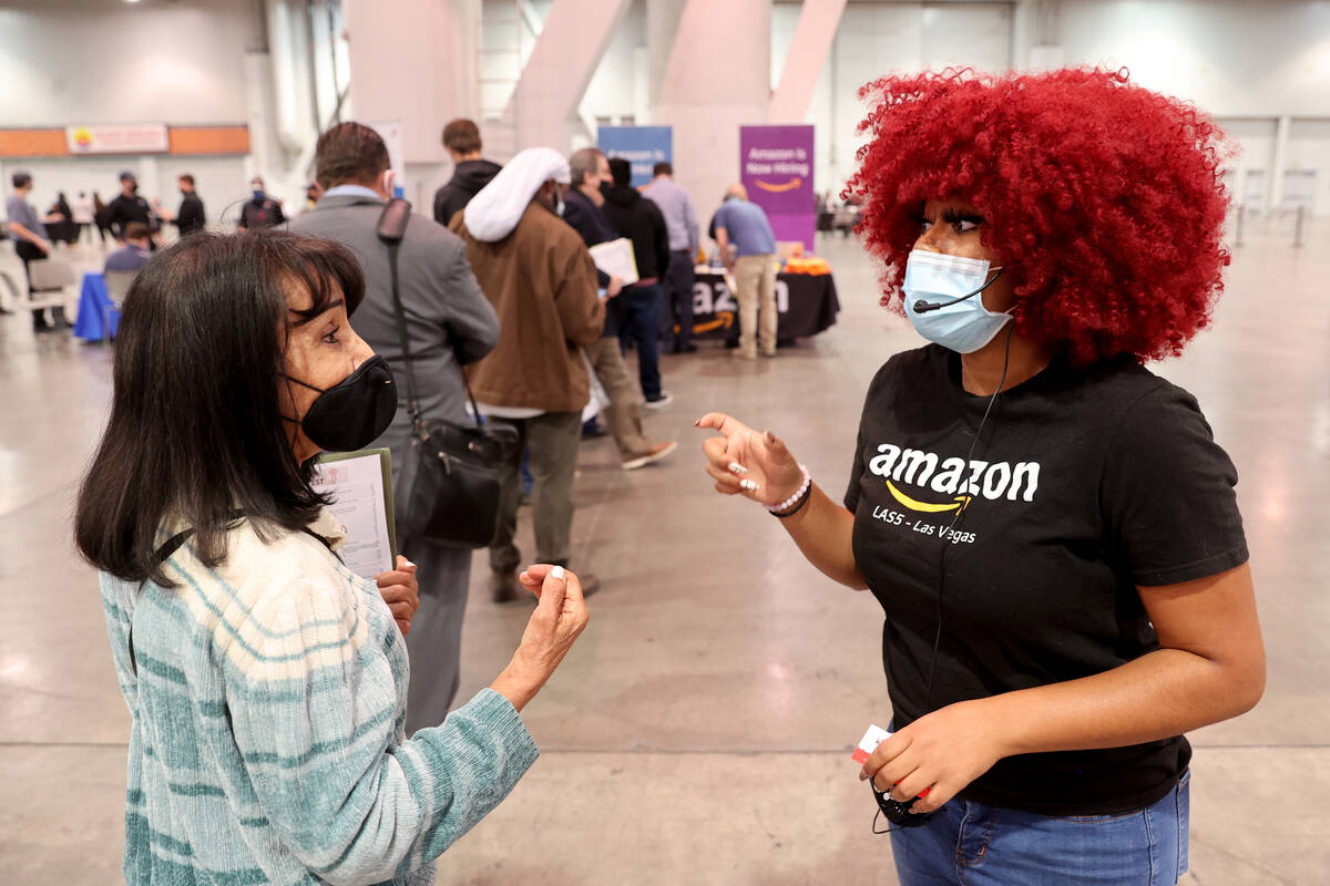 Jalyn Anderson, right, of Amazon talks to job seeker Nabila Shawly of Las Vegas during JobFest ...