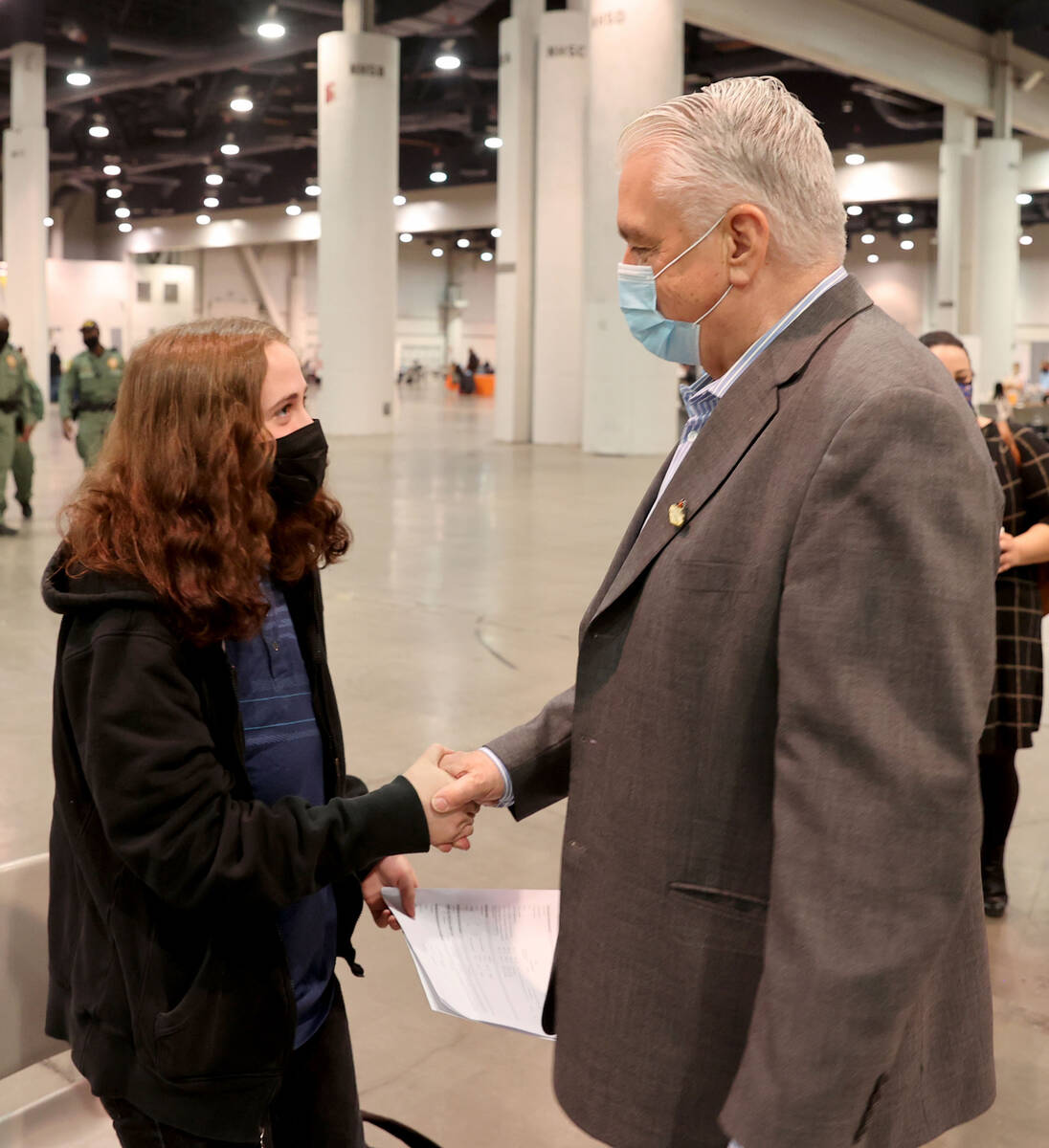 Lillian Prince, 18, of Las Vegas is congratulated on her job offer by Gov. Steve Sisolak during ...