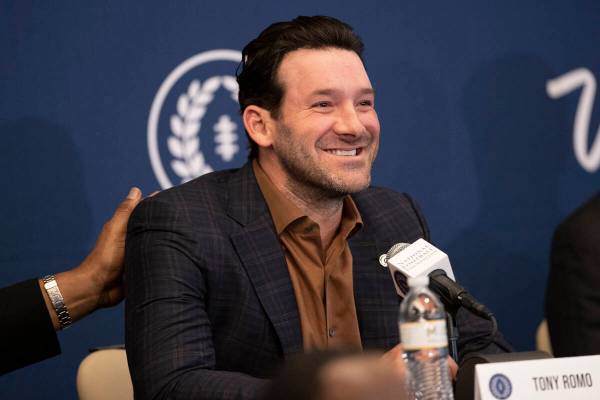 Former football player Tony Romo speaks during the College Football Hall of Fame introduction c ...