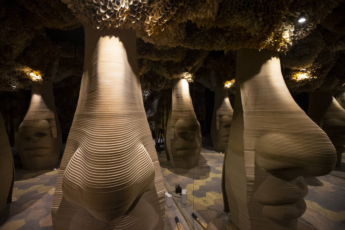 Honeycombs with sculptures of noses, which give visitors olfactory experiences, are seen during ...