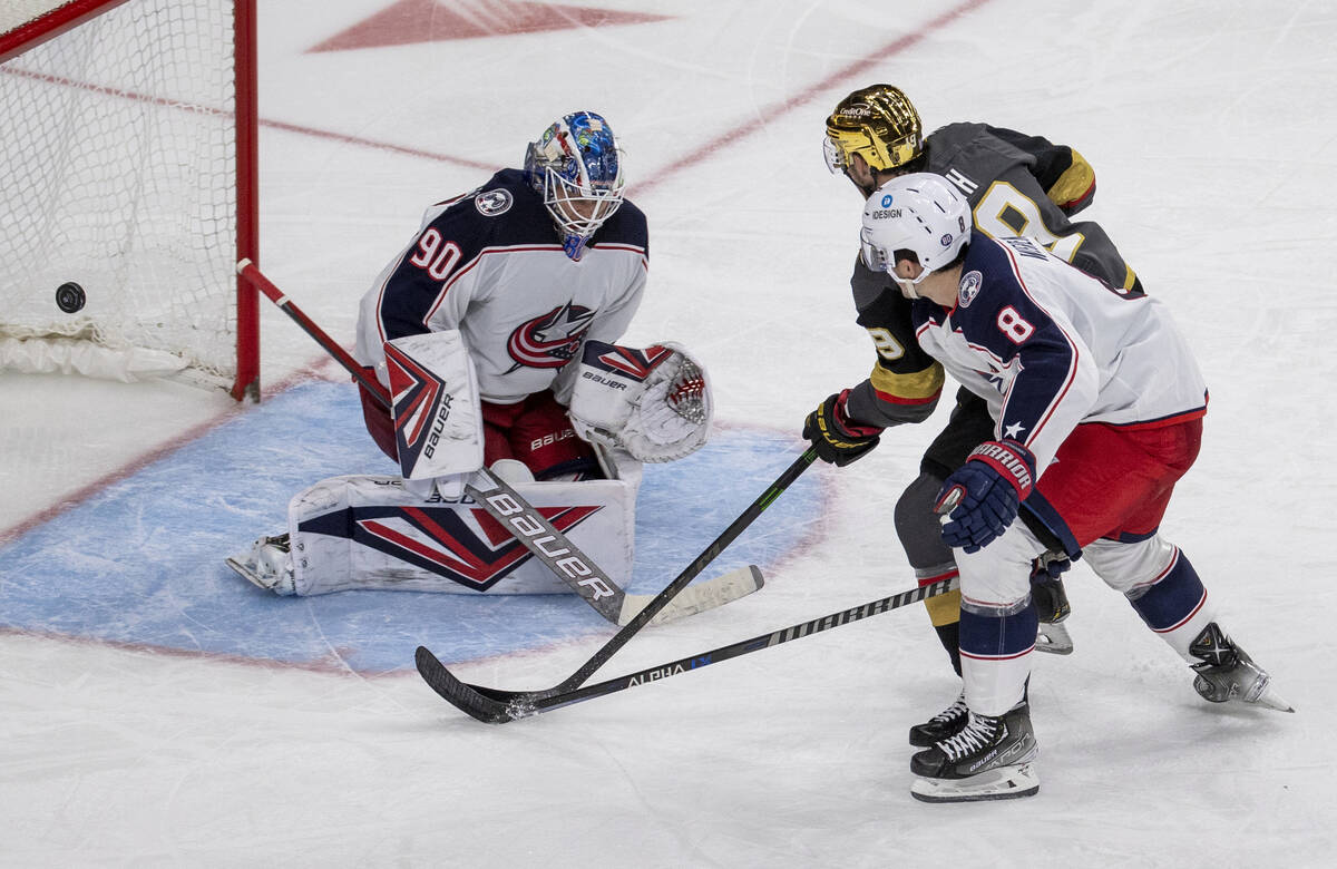 Golden Knights right wing Reilly Smith (19) scores on Columbus Blue Jackets goaltender Elvis Me ...