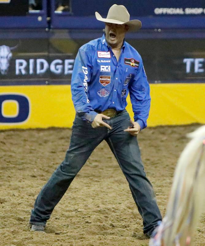 Tyler Waguespack of Gonzales, La. reacts after he competed in the steer wrestling event during ...