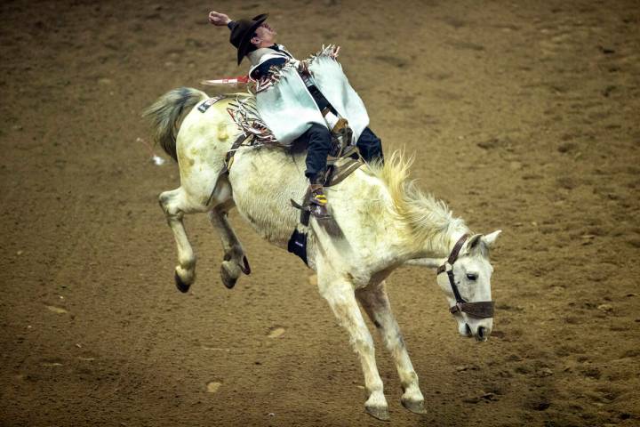 Cole Franks of Clarendon, TX., rides Deep Springs for first place in Bareback Riding during the ...