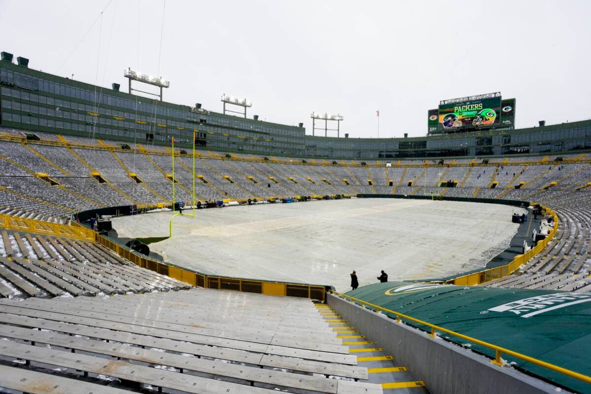 Snow is seen at Lambeau Field before an NFL football game between the Green Bay Packers and the ...