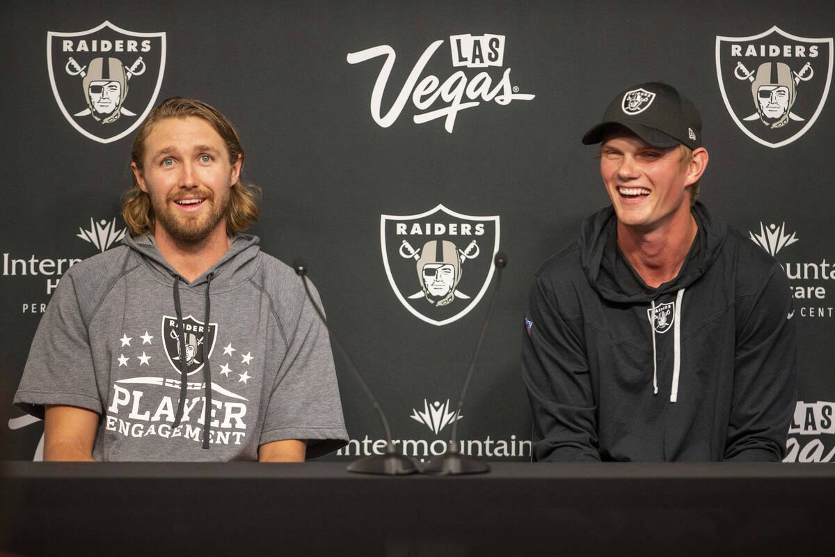 Raiders punter A.J. Cole, left, and Raiders kicker Daniel Carlson laugh during a news conferenc ...