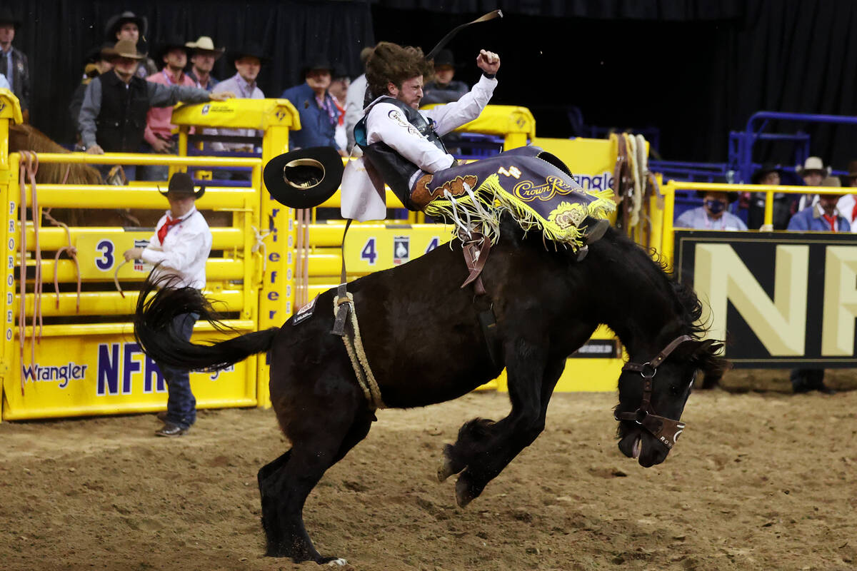 Tilden Hooper of Carthage, Texas, competes in the bareback riding event during the ninth go-rou ...