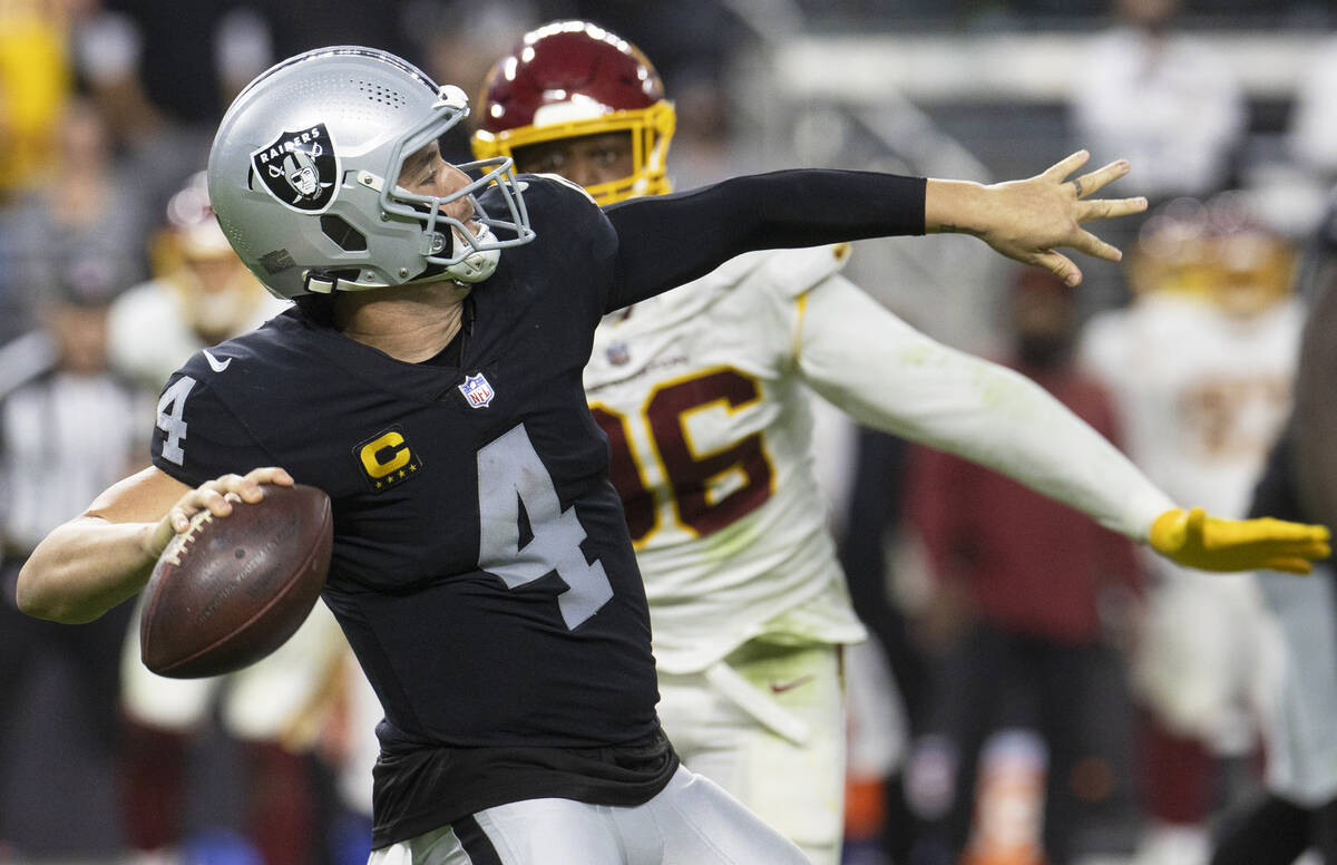 Raiders quarterback Derek Carr (4) makes a throw past Washington Football Team defensive end Ja ...