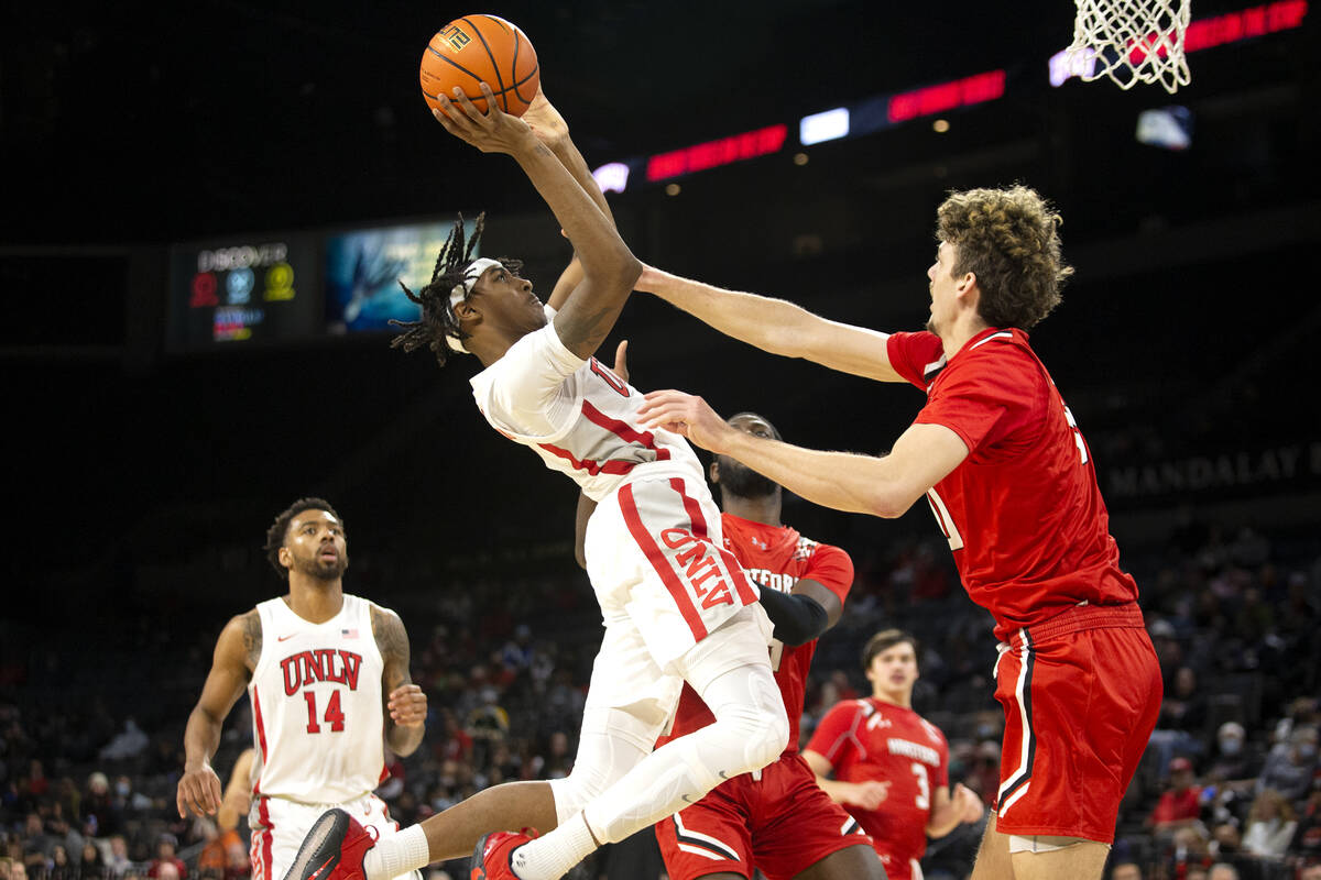 UNLV Rebels forward Donovan Williams (3) shoots against Hartford Hawks forward Hunter Marks (0) ...