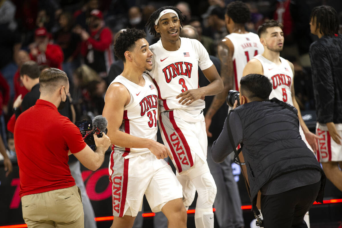 UNLV Rebels guard Marvin Coleman (31) celebrates with forward Donovan Williams (3) after winnin ...