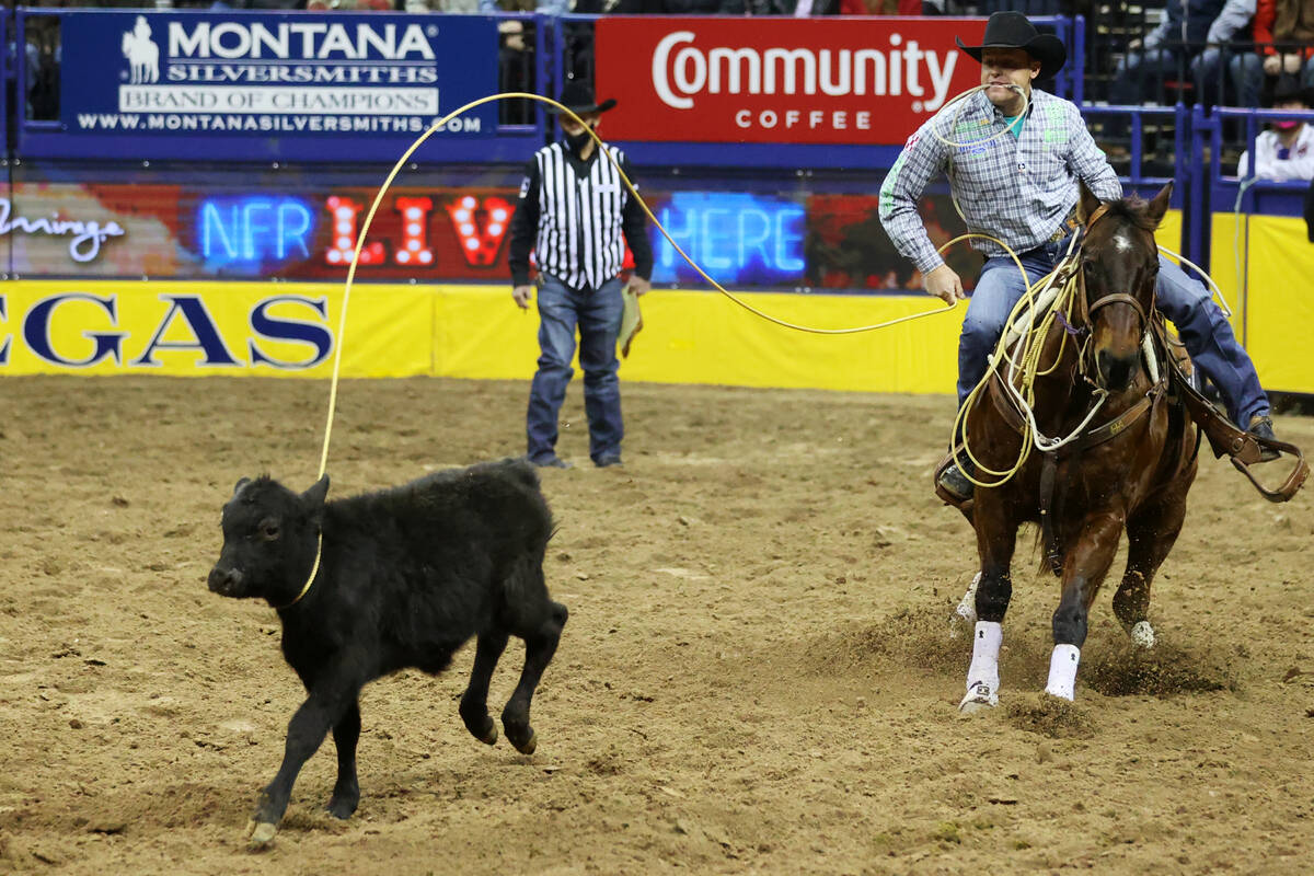 Caleb Smidt of Belville, Texas, competes in the tie-down event during the tenth go-round of the ...
