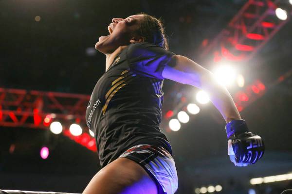 Julianna Pena reacts after defeating Amanda Nunes by submission in a women's bantamweight mixed ...