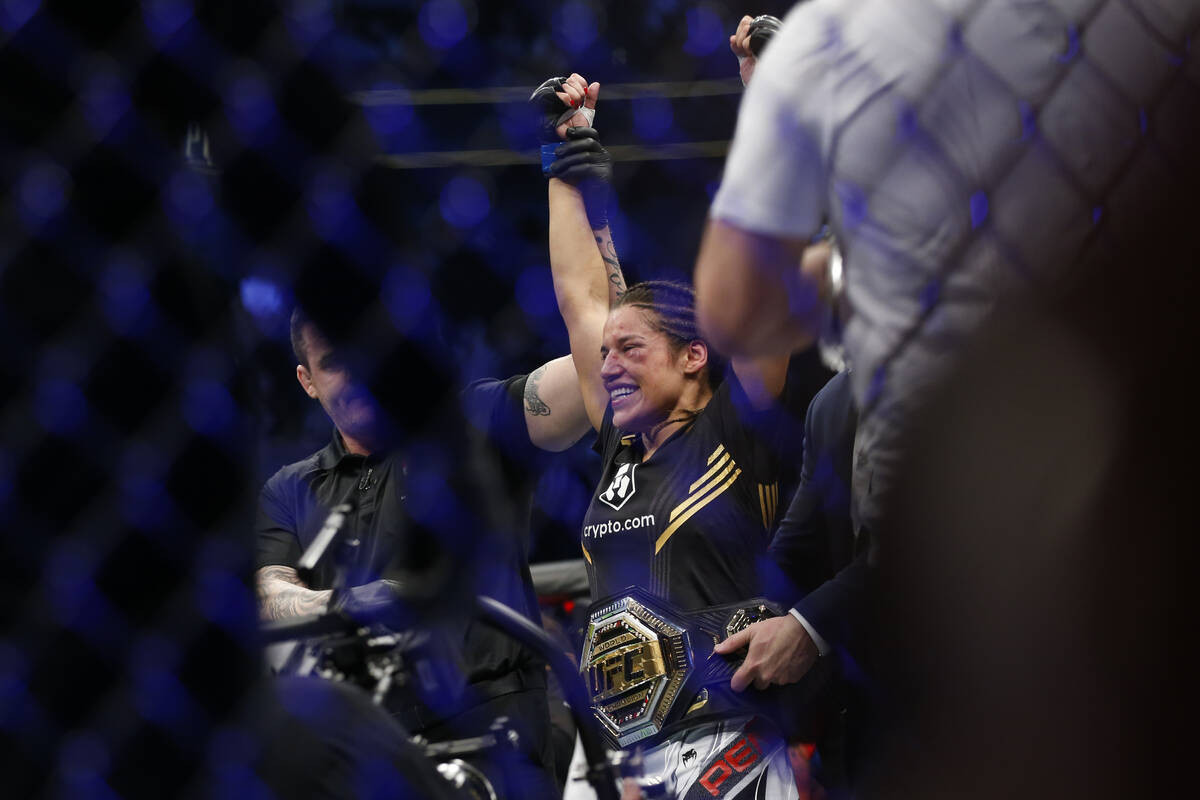 Julianna Pena smiles after defeating Amanda Nunes by submission in a women's bantamweight mixed ...