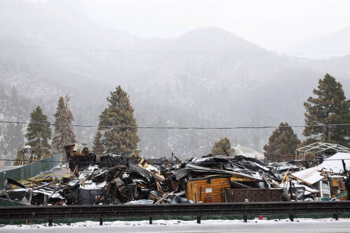 Debris of the former Mount Charleston Lodge is seen as light snow fall on the Mt. Charleston ar ...