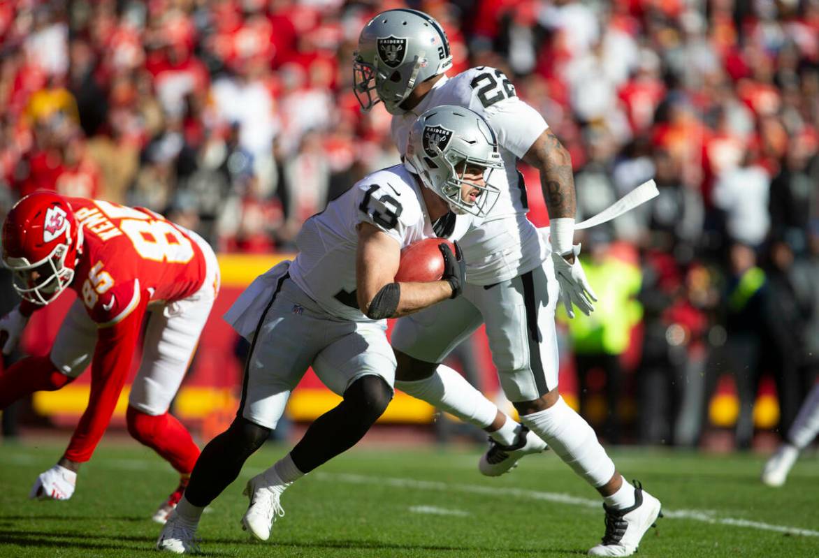 Raiders wide receiver Hunter Renfrow (13) runs with the football on a punt return during the fi ...