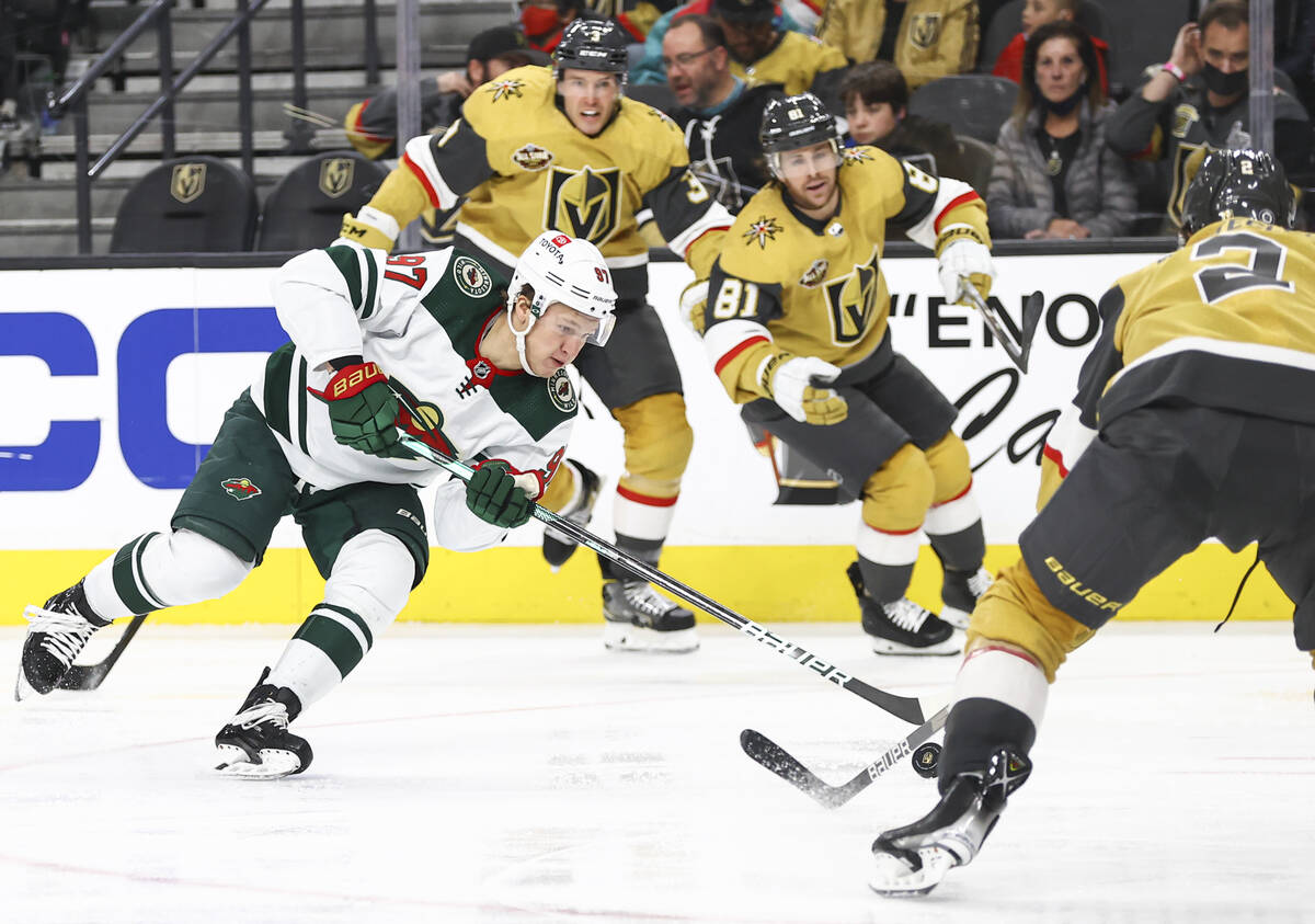 Minnesota Wild left wing Kirill Kaprizov (97) and Golden Knights defenseman Zach Whitecloud (2) ...