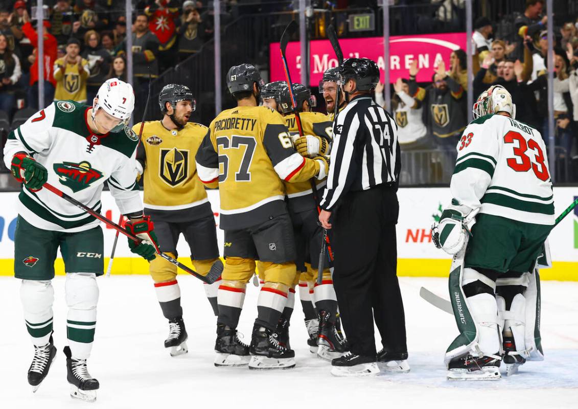 The Golden Knights celebrate after a goal against the Minnesota Wild during the first period of ...